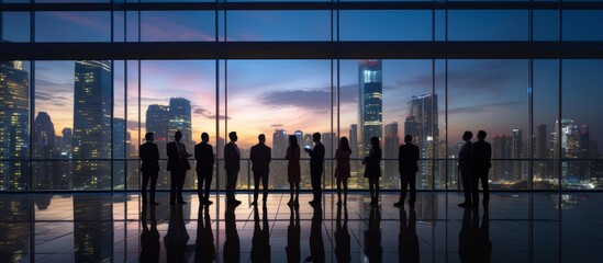 Fototapeta na wymiar business partnership agreement ideas concept group of silhouette business teamwork standing together with background of downtown urban city office building background multi exposure