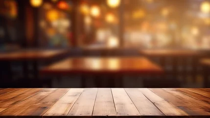 Poster Blurred coffee shop and restaurant interior background with empty wooden table. Use for products display or montage. © Vusal
