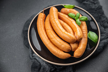 sausage chicken or turkey meat Cooking sausages appetizer meal food snack on the table copy space...