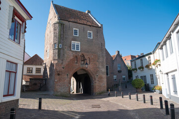 Fototapeta na wymiar Woudrichem, The Netherlands - The Prison Gate is the only remaining water gate as part of the fortifications. The gate also served as a prison.