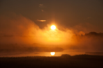 Fototapeta na wymiar Sunrise and early morning fog in the Kokemäenjoki river delta in Pori, Finland