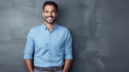 Obraz premium portrait of a handsome and confident young man posing against a gray background 