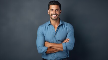 portrait of a handsome and confident young man posing against a gray background  - obrazy, fototapety, plakaty