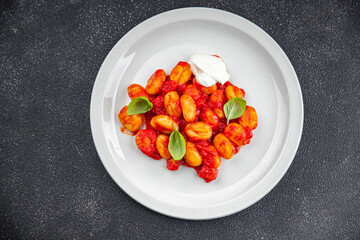 gnocchi tomato sauce no meat potato dish meal food snack on the table copy space food background rustic top view vegetarian vegan food  