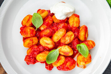 gnocchi tomato sauce no meat potato dish meal food snack on the table copy space food background rustic top view vegetarian vegan food  