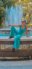 Beautiful model posing in a fountain