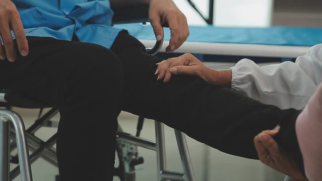 Therapist treating a male injured by rotator cuff stretching method, Physical therapy concept.