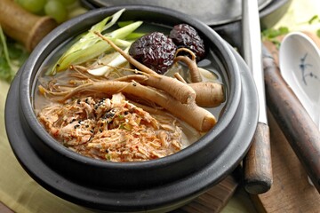 Soul-Warming Sam Gye Tang: 4K Image of Chicken Soup with Ginseng, Roasted Garlic, and Raisin Tree...