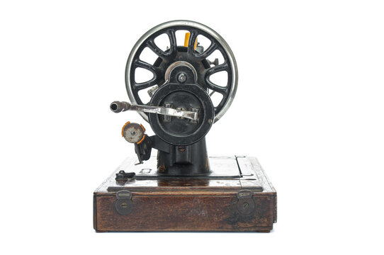 Antique, old sewing-machine isolated on white background