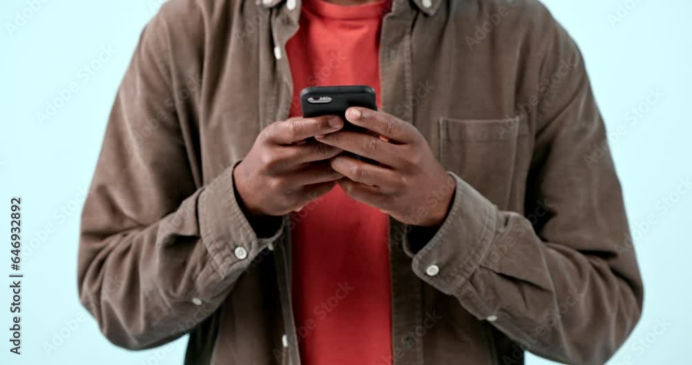 Poster Hands, phone and man typing in studio isolated on blue background. Smartphone, closeup and person scroll on internet search app, social media networking and online communication on digital technology