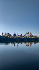 beautiful fairy-tale buildings against the backdrop of a summer lake
