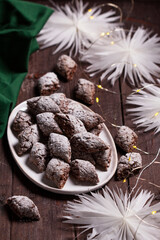 Italian Christmas cookies Castagnelle with almonds, cocoa and egg whites on a wooden background. Gluten free cookies. - 646947067