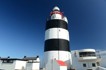 The Hook lighthouse, County Wexford, Ireland, national landmark on a beautiful September day.