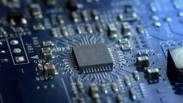 Integrated circuit board with processor close-up.  4K Horizontal. 