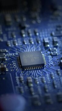 Integrated circuit board with processor close-up.  4K vertical.