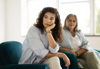Upset offended unhappy caucasian adult woman ignores old mom, has stress, depression at quarrel