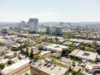 Glendale, California – September 9, 2023: drone view toward Glendale CA with 134 freeway and Glendale downtown buildings, apt, houses, homes