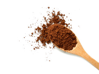 Pile of cocoa powder in wooden spoon