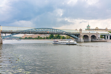 View of the Moscow river embakment, Pushkinsky bridge and cruise ships at sunset.