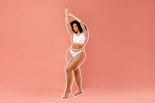 Hot black woman posing in white underwear, raising hands up