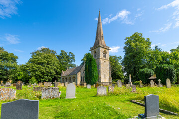 The Parish Church of Saint Mary Lower Slaughter rises above the historic cemetery on it's grounds...