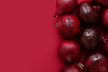 Fresh red onions on color background
