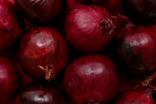 Texture of fresh red onions, closeup