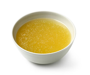 Bowl of tasty vegetable broth on white background