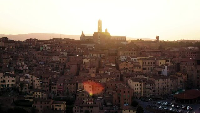Aerial of old town Siena skyline and city center at sunset in Tuscany, Italy 8
