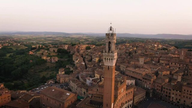 Aerial of old town Siena skyline and city center at sunset in Tuscany, Italy 6