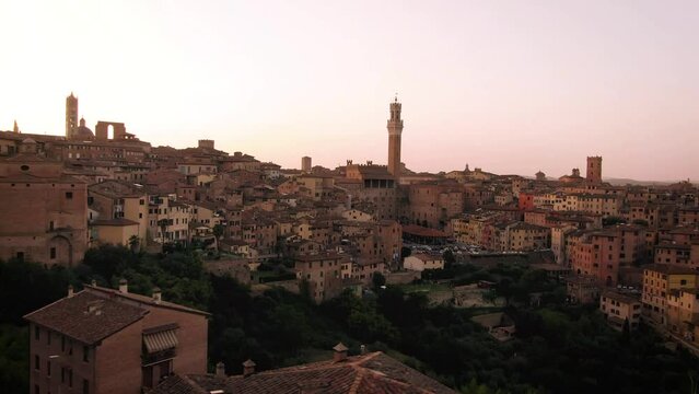 Aerial of old town Siena skyline and city center at sunset in Tuscany, Italy 5