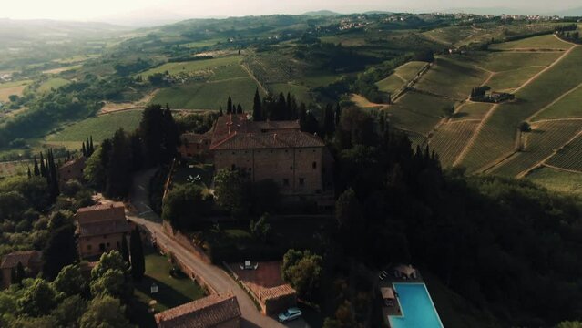 Aerial of private Tuscan villa castle on a hilltop in the country side, Tuscany, Italy 4