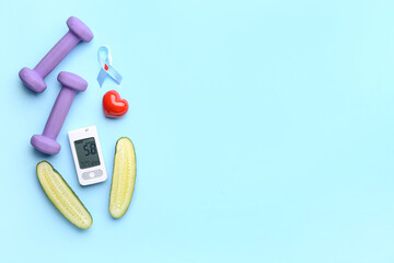 Glucometer with heart, cucumber, dumbbells and awareness ribbon on blue background. Diabetes concept