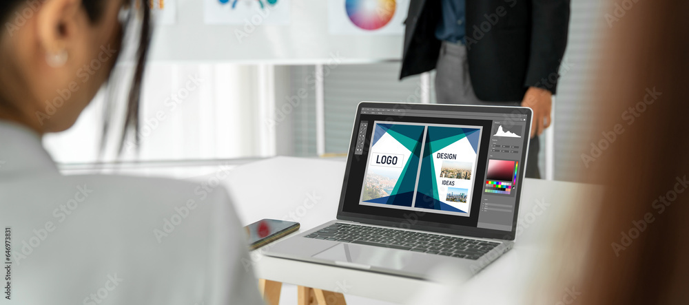 Poster graphic designer software for modern design of web page and commercial ads showing on the computer s