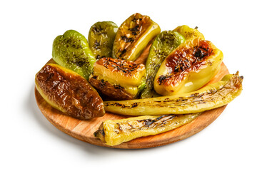 Board with different grilled peppers on white background