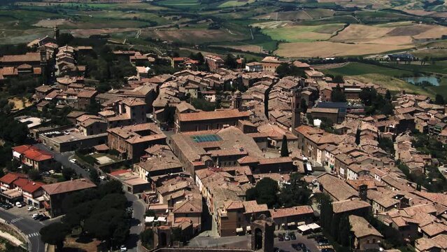 Aerial of historic hilltop castle town in the Tuscan country side, Tuscany, Italy 1