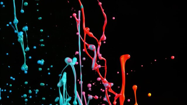 Super slow motion of dancing colors, isolated on black background. Filmed on high speed cinema camera, 1000 fps.