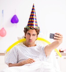 Young man celebrating his birthday in hospital
