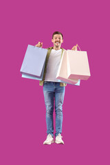 Jumping man with shopping bags on magenta background