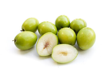 Green jujube fruits on white background.