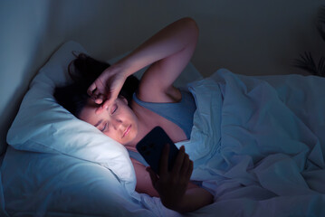 Nocturnal struggles: A woman's battle against insomnia and social media addiction unfolds in the...
