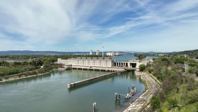 Aerial panorama: Donz&egrave;re-Mondragon Dam, a storied green energy landmark.
