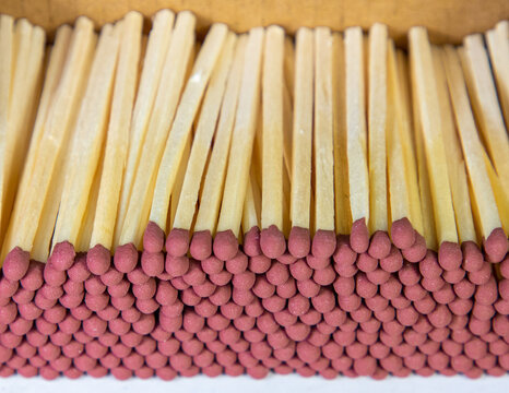 A close-up of a group of stacked matchsticks