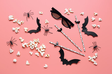 Composition with tasty popcorn, 3D glasses, paper bats, straws and spiders for Halloween celebration on pink background