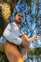 young man focused man playing music