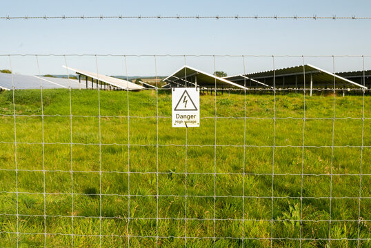 Danger,High Voltage sign at Solar farm,Gloucestershire,England,United Kingdom.