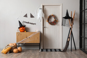Interior of hall decorated for Halloween with door and commode