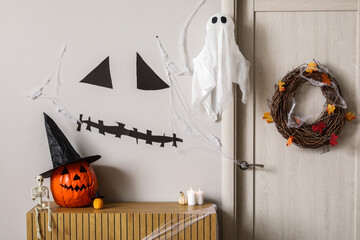 Interior of hall decorated for Halloween with door and commode