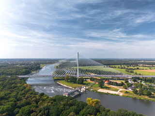 Aerial view of the cable-stayed Rędziński bridge (Most Rędziński) over Oder river in Pilczyce, Wrocław, Poland © uslatar