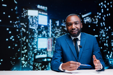 TV reporter on midnight talk show broadcasting daily information regarding breaking news, transmitting live on global television network. African american journalist reading headlines in studio.